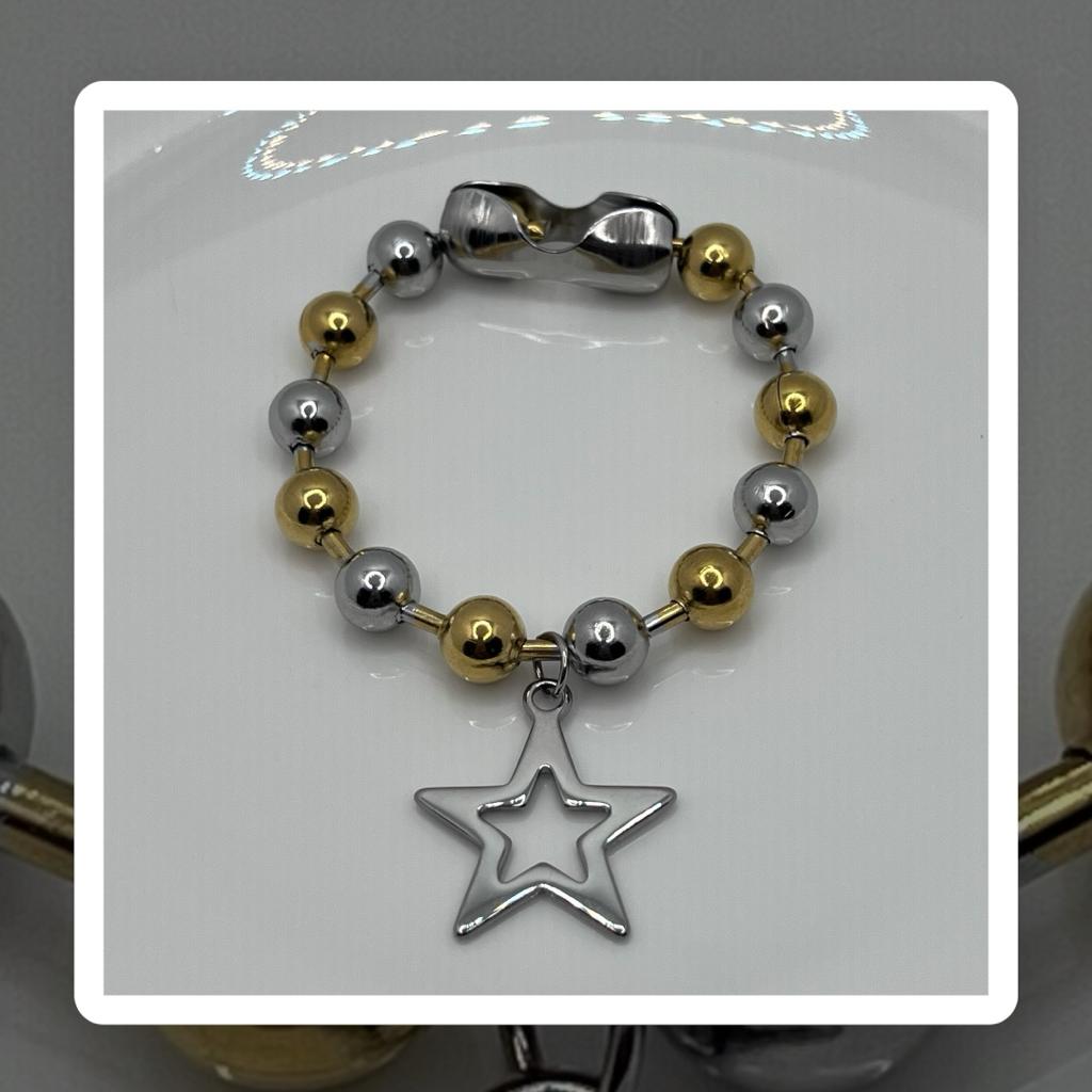 Pulsera estrella doble tono